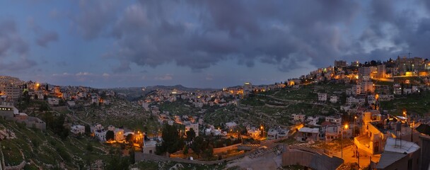 View on streets with night lights in old historical biblical city Bethlehem in palestine region in Israel on evening - obrazy, fototapety, plakaty