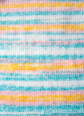 Fototapeta premium Knitted texture. Pattern fabric made of wool. Background, copy space. Handmade sweater texture, knitted wool pattern