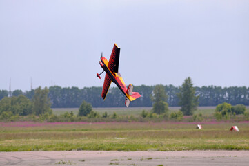 Radio controlled plane flying in the sky performing aerobatics