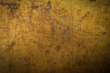 Texture or background of metal with rust and scuffs. Material gold