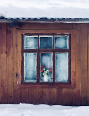 old wooden window in the old house in winter, traditional archotecture