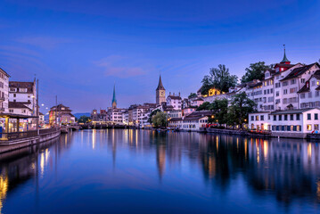 Naklejka na ściany i meble Zurich evening skyline above the Limmat River