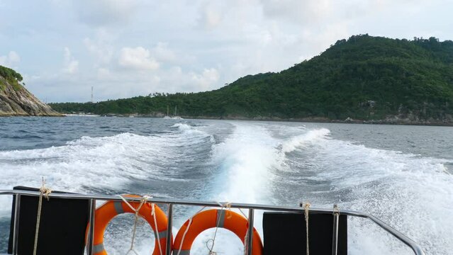 Water splashes seen from the motorboat. Big waves done by Speedboat into the sea. Tourism and travel concept