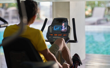 A man exercise by climber in fitness center in the morning.