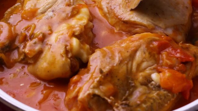 Chicken with beans and vegetables in red sauce