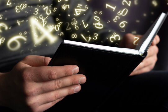 numerology, a man holds an open book in his hands, surrounded by numbers