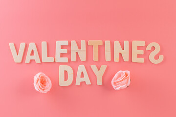 Text or word Valentines day with pink rose on top view for background
