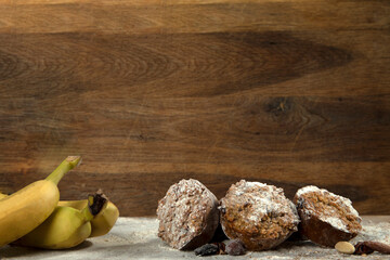 Banana muffins cake on wooden background copy space, Stack of banana cupcakes walnut, healthy low carb diet concept. vegan food
