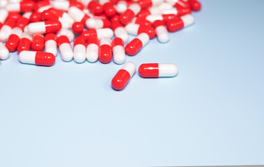 Medical colourful pills on blue background. Health concept. Vitamin. 