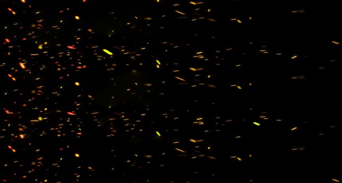 sparks like particles floating in air over black background
