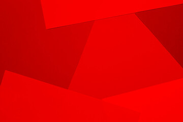 Obraz premium Sheets of colored paper in red shades as a background. Mockup, copy space. Geometric print.