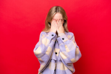 Young English woman isolated on red background with tired and sick expression