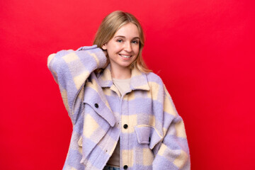 Young English woman isolated on red background laughing