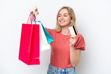 Young English woman isolated on white background holding shopping bags and a credit card