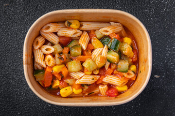 pasta salad tomato, cucumber, corn, vegetables healthy meal food snack on the table copy space food background rustic top view veggie vegan or vegetarian food no meat