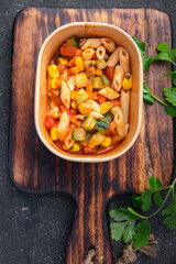 pasta salad tomato, cucumber, corn, vegetables healthy meal food snack on the table copy space food background rustic top view veggie vegan or vegetarian food no meat