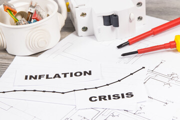 Various electrical components, work tools, installation plan, inscriptions inflation and crisis. High prices of building or renovation home