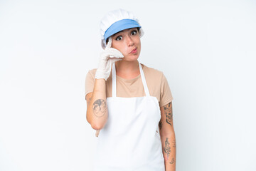 Fishmonger wearing an apron and holding a raw fish isolated on white background thinking an idea