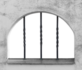 Window with metal rods in concrete wall