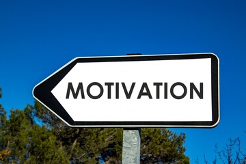 the word motivation written on a sign