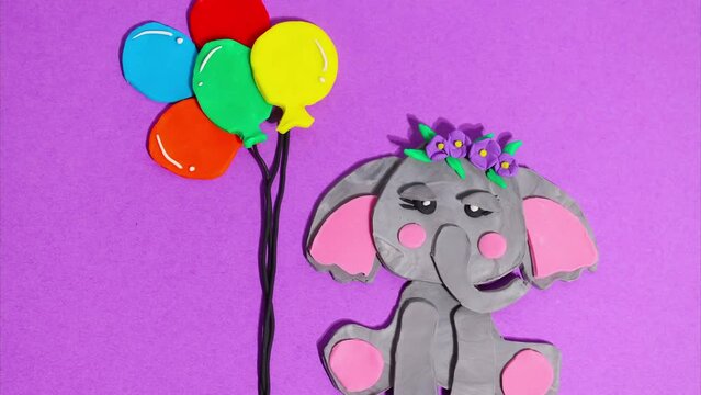 Cute elephant baby girl with a flower wreath on her head next to balloons. Stop motion animation. Concept of children's holiday, birthday, video card on a purple background.