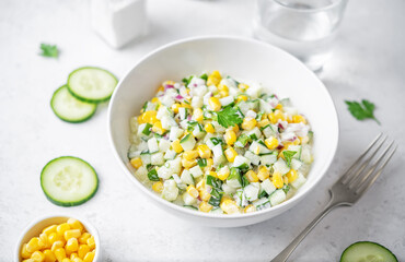 Cucumber corn salad in a bowl