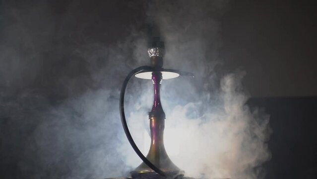 hookah on the table and hookah in clouds of smoke. High quality Full HD video recording