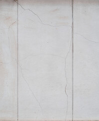 White textured stone wall background.