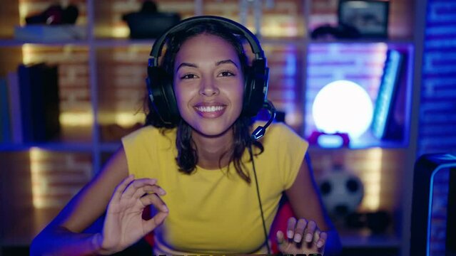 Young african american woman streamer smiling confident having video call at gaming room