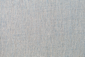 Texture of woven fabric, close-up, light tone.