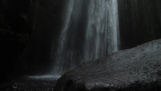 Powerful Gljufrabui or Gljufurarfoss hidden waterfall inside the cave near Seljalandsfoss in Iceland. High quality 4k footage