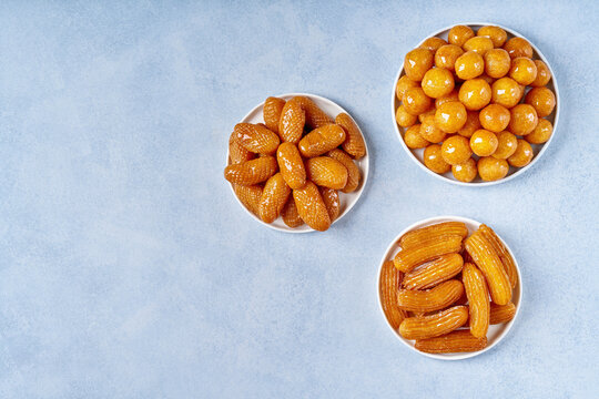 Traditional middle eastern fried sweets lokma, awameh, zainab fingers, balah al sham . Ramadan dessert . Top view, copy space