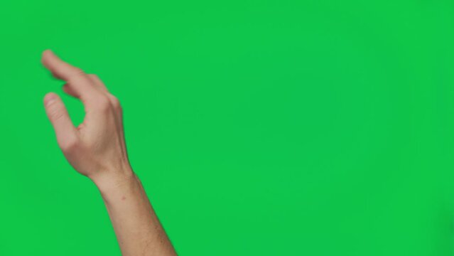 Male hand touching, clicking, tapping, sliding and swiping on chroma key green screen background. Different signs and gestures with fingers. Gestures pack. Using a smartphone, tablet or a touchscreen.