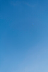 big full moon over cloud free blue sky