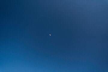 big full moon over cloud free blue sky