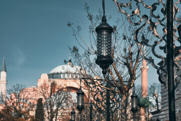 Authentic Ottoman Decorative street lamp and Hagia Sophia Church Mosque blurred in the background. Eid Al-Ramadan wallpaper, background