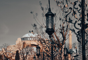 Authentic Ottoman Decorative street lamp and Hagia Sophia Church Mosque blurred in the background. Eid Al-Ramadan wallpaper, background
