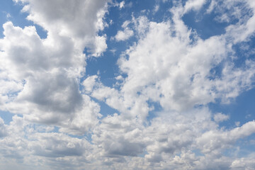 Cloudscape - Blue sky and white clouds, wide panorama.