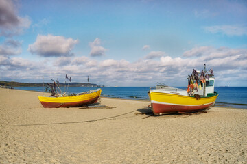 Fototapeta premium The Baltic Sea, the Polish city of Sopot and on the beach, a fishing boat 