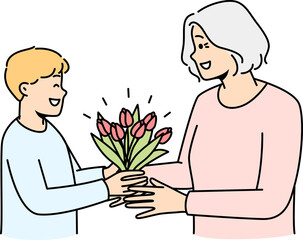 Smiling boy greeting granny with flowers