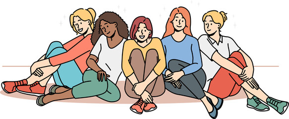 Happy multiethnic girls sitting together