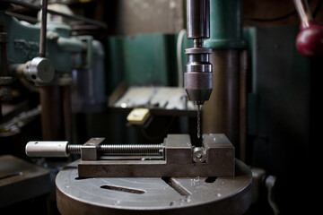 Part machining with drilling machine