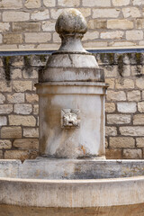 Ancient drinking water fountain in Aigues-Mortes.