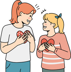 Smiling girls with paper hearts in hands