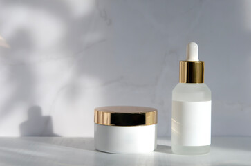 Matt glass dropper bottle and container with cream mockup. Branded packaging with blank label...