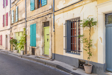 Fototapeta na wymiar Potted plants along a street in Arles.