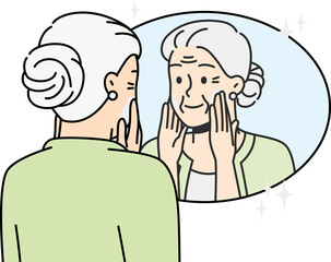 Elderly lady puts anti-aging cream on face at home.