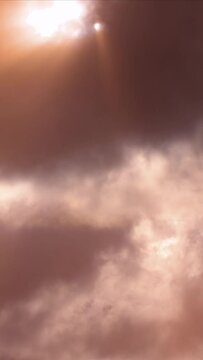 Vertical video of beautiful and colorful red sunset cloudy sky as a timelapse cloudscape.