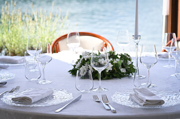  Table setting - plate, knife and fork on table. Wedding decorations and items 
