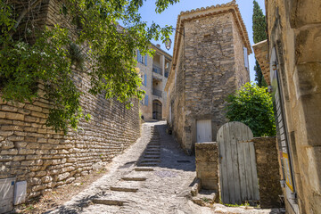 Fototapeta na wymiar A steep narrow street in a small town in Provence.